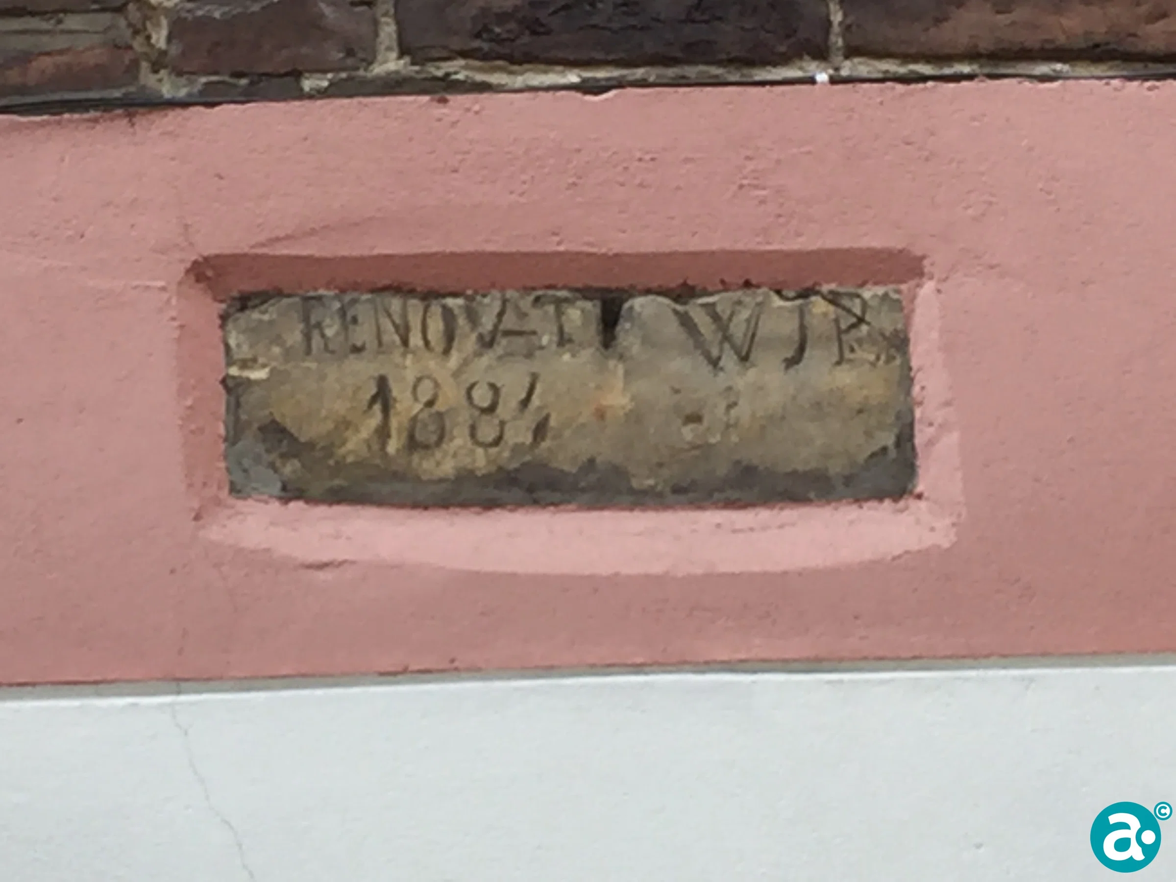 Gevelsteen zijgevel pand Poell